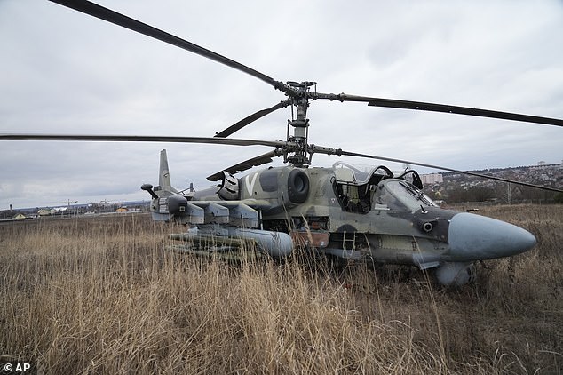 54604655-10549237-A_Russian_Ka_52_helicopter_gunship_is_seen_in_the_field_after_a_-a-6_1645741193296.jpg