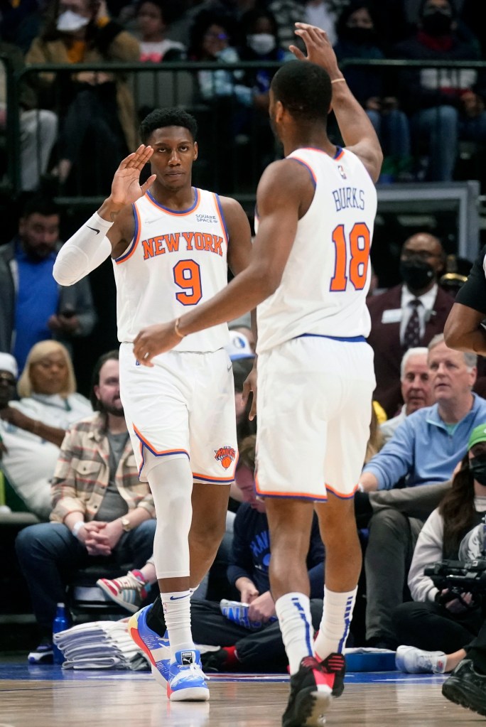 RJ Barrett, who scored 18 points, gets a high five from Alec Burks during the Knicks' win.