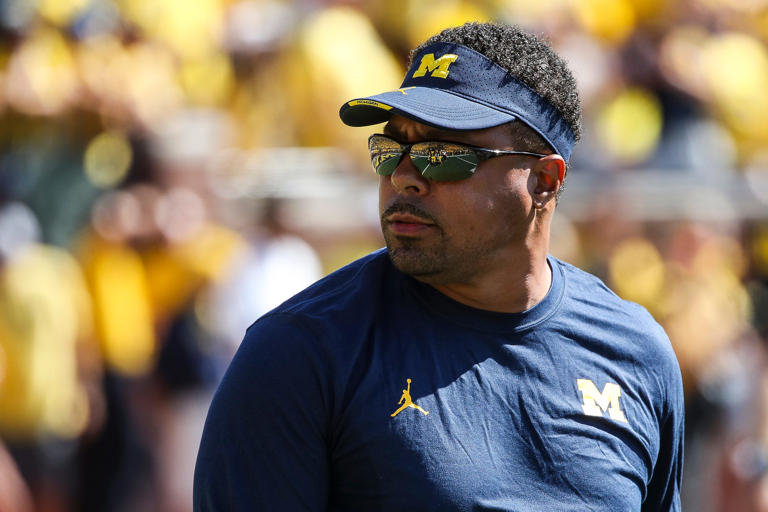 Michigan running back coach Mike Hart watches warm up before the East Carolina game at Michigan Stadium in Ann Arbor, Saturday, Sept. 2, 2023.