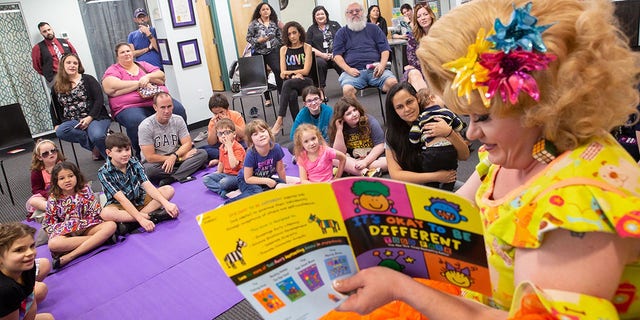 Rich Kuntz, also known as Gidget, reads to children during Drag Queen Story Hour on March 21, 2019. The LGBT+ Center Orlando canceled a weekend drag queen story hour for children after receiving online threats.  