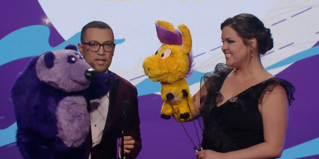 Two performers utilizing puppets announce an award for gay teen romance Heartstopper at the first annual Children's and Family Emmy awards. 