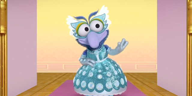 An image from an episode of Muppets Babies called Gonzo-rella in which the character of Gonzo used they/them pronouns and wears a dress. 