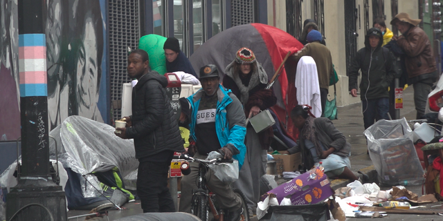 Tents and people along a street in San Francsico