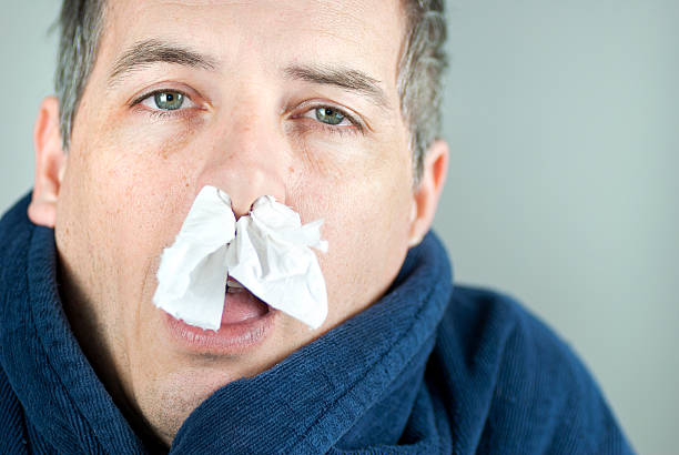 man-with-tissue-in-nose.jpg