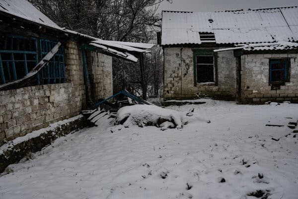 The carcass of a cow in front of a home in the village of Makiivka, near Nevske, on Saturday.