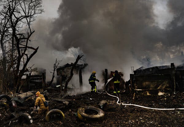Emergency workers put out a fire minutes after a missile strike in the center of Kramatorsk, eastern Ukraine, last week.