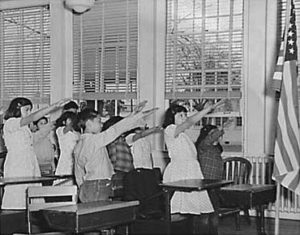 Students_pledging_allegiance_to_the_American_flag_with_the_Bellamy_salute-300x235.jpg